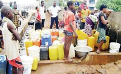 group of people fetching of water