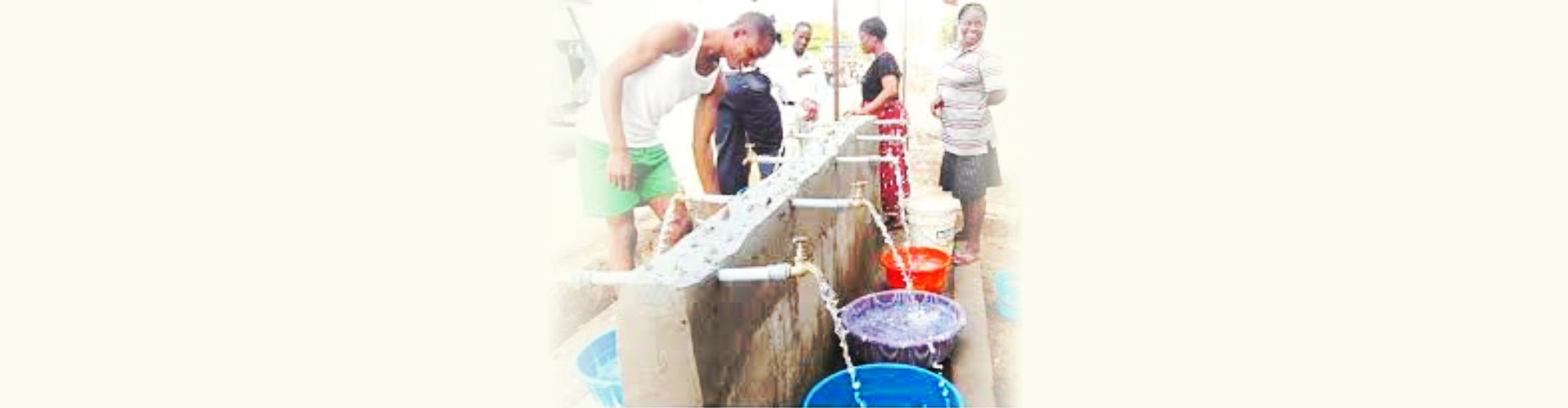 group of people fetching water